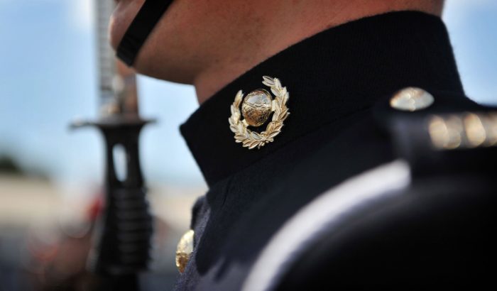 Royal Marine standing in uniform at a passing out parade